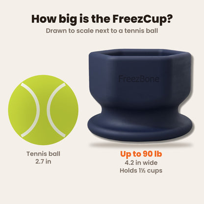 FreezCup size guide drawn to scale next to a tennis ball: 4.2 in wide, holds 1 1/2 cups, for dogs up to 90 lb